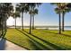 Expansive grassy area by the lake, ideal for relaxation at 1402 Westminster Way, Kissimmee, FL 34744