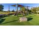 Modern playground with shade structures and natural elements at 1402 Westminster Way, Kissimmee, FL 34744