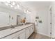 Double vanity bathroom with modern finishes and plenty of counter space at 11843 Imaginary Way, Orlando, FL 32832