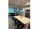 Modern kitchen with an island and breakfast bar, open to the dining area at 3120 Paradox Cir # 102, Kissimmee, FL 34746