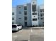 Modern condo building with parking and attractive exterior at 3120 Paradox Cir # 102, Kissimmee, FL 34746
