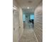 Long hallway with tile floors and patterned wall at 3120 Paradox Cir # 102, Kissimmee, FL 34746
