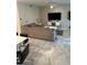 Living room featuring a large sectional sofa and wall-mounted TV at 3120 Paradox Cir # 102, Kissimmee, FL 34746