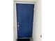 Blue front door with keyless entry and a doormat at 3120 Paradox Cir # 102, Kissimmee, FL 34746