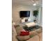 Spacious living room with comfortable sectional sofa and large flat-screen TV at 3120 Paradox Cir # 102, Kissimmee, FL 34746