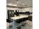 Modern kitchen with island, stainless steel appliances, and white cabinets at 3120 Paradox Cir # 102, Kissimmee, FL 34746