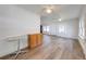 Bright living room with laminate floors and ceiling fan at 1015 Ohio Ave, Saint Cloud, FL 34769