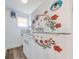 Small kitchen with white appliances and floral decor at 1015 Ohio Ave, Saint Cloud, FL 34769