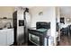 Stainless steel appliances and wood flooring in this galley kitchen at 1015 Ohio Ave, Saint Cloud, FL 34769