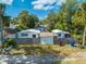 Three houses with a shared fence and yard at 1015 Ohio Ave, Saint Cloud, FL 34769