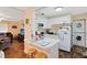 Small kitchen with white cabinets and breakfast bar at 1015 Ohio Ave, Saint Cloud, FL 34769