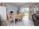 Bright dining room with wood table and six chairs at 3617 Scarlet Oak Dr, Saint Cloud, FL 34772