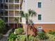 Building exterior with landscaping and walkway at 3050 Pirates Retreat Ct # 108, Kissimmee, FL 34747