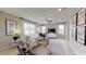 Spacious living room featuring large windows and ample natural light at 4227 Sawtooth Ct, Tavares, FL 32778