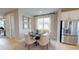 Dining area with round table and chairs, adjacent to the kitchen at 4227 Sawtooth Ct, Tavares, FL 32778