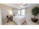 Well-lit bedroom with a comfortable bed and natural light at 4227 Sawtooth Ct, Tavares, FL 32778