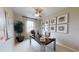 Bright home office with large window, desk, and wall art at 4227 Sawtooth Ct, Tavares, FL 32778