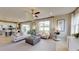 Open living room with views into the kitchen and access to the backyard at 4227 Sawtooth Ct, Tavares, FL 32778