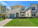 Modern two-story house with a green door and stone accents at 2769 Bookmark Dr, Kissimmee, FL 34746