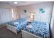 Guest bedroom with twin beds and charming decor at 2505 Dharma Cir, Kissimmee, FL 34746
