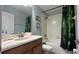 Clean bathroom with a bathtub, shower, and updated vanity at 8860 Candy Palm Rd, Kissimmee, FL 34747