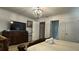 Bedroom with king-size bed and access to hallway at 8860 Candy Palm Rd, Kissimmee, FL 34747
