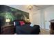 Pirate-themed bedroom with full-size bed and tropical wall mural at 8860 Candy Palm Rd, Kissimmee, FL 34747