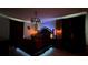 King-size bed with dark wood furniture and unique lighting in a bedroom at 8860 Candy Palm Rd, Kissimmee, FL 34747