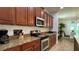 Modern kitchen featuring granite countertops and ample cabinetry at 8860 Candy Palm Rd, Kissimmee, FL 34747