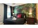 Bedroom with a pirate theme, full-size bed, and tropical mural at 8860 Candy Palm Rd, Kissimmee, FL 34747