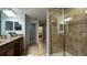Bathroom with double vanity, granite countertop and shower at 8860 Candy Palm Rd, Kissimmee, FL 34747