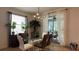 Elegant dining room with glass table and modern light fixture at 8860 Candy Palm Rd, Kissimmee, FL 34747
