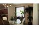 Bright dining area featuring a glass top dining table and modern decor at 8860 Candy Palm Rd, Kissimmee, FL 34747