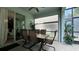 Covered patio with table and chairs, ideal for dining al fresco at 8860 Candy Palm Rd, Kissimmee, FL 34747