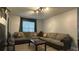 Cozy living room featuring a sectional sofa and coffee table at 8860 Candy Palm Rd, Kissimmee, FL 34747