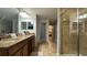 Bathroom with double vanity, granite countertop and shower at 8860 Candy Palm Rd, Kissimmee, FL 34747
