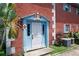 Brick building with light blue entryway and landscaping at 3045 Aaron Burr Ave # 10, Winter Park, FL 32792