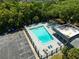 Community pool with surrounding lounge area at 3045 Aaron Burr Ave # 10, Winter Park, FL 32792