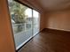 Bedroom with sliding glass doors leading to a private deck at 3045 Aaron Burr Ave # 10, Winter Park, FL 32792