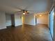 Spacious living room with wood-look floors and sliding doors at 3045 Aaron Burr Ave # 10, Winter Park, FL 32792