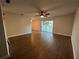 Bright living room with wood-look floors and sliding doors to balcony at 3045 Aaron Burr Ave # 10, Winter Park, FL 32792