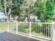 Private deck overlooking a grassy courtyard with trees at 3045 Aaron Burr Ave # 10, Winter Park, FL 32792