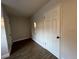 Small bedroom with a closet and wood-look flooring at 3045 Aaron Burr Ave # 10, Winter Park, FL 32792