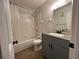 Updated bathroom with gray vanity and tub shower combo at 3045 Aaron Burr Ave # 10, Winter Park, FL 32792