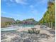 Relaxing community pool and spa area with patio furniture at 3045 Aaron Burr Ave # 10, Winter Park, FL 32792