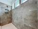 Walk-in shower with gray tile and a built-in niche at 14822 Porter Rd, Winter Garden, FL 34787