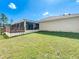Spacious backyard with screened patio and fenced area at 119 Talavera Ln, Kissimmee, FL 34758