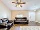 Living room with ceiling fan and an arched doorway at 119 Talavera Ln, Kissimmee, FL 34758