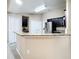 Kitchen boasts granite countertops and stainless steel appliances at 119 Talavera Ln, Kissimmee, FL 34758