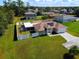 Aerial view of house, fenced yard, and solar panels at 119 Talavera Ln, Kissimmee, FL 34758